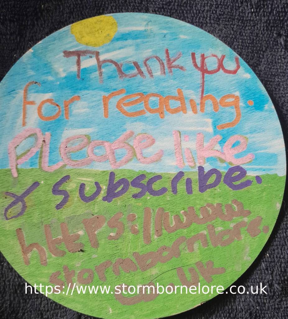 A hand-painted circular sign featuring a blue sky, green grass, and a sun, with colorful text that says, 'Thank you for reading. Please like & subscribe. https://www.stormbornelore.co.uk'.