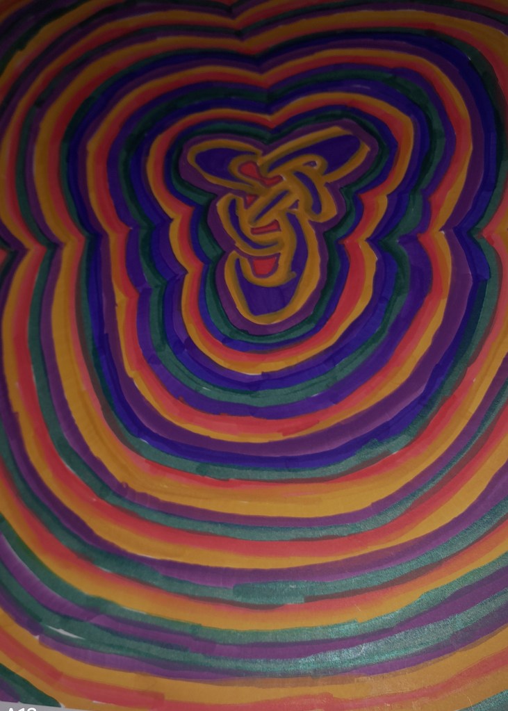 A vibrant abstract design featuring concentric circles in various colors, including purple, orange, and green, creating a layered visual effect.