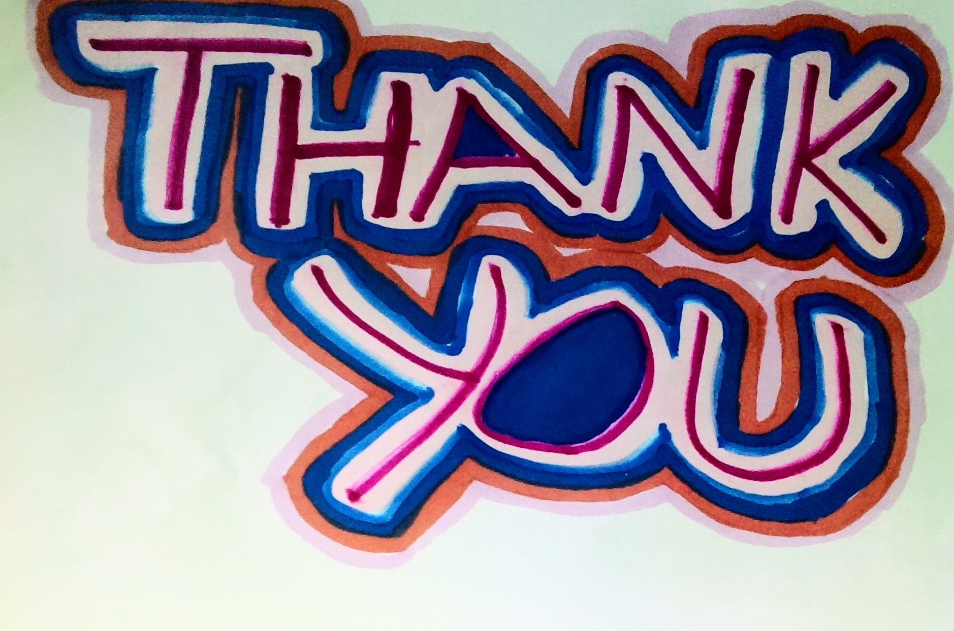 Colorful 'THANK YOU' handwritten sign with bold letters and a vibrant design.